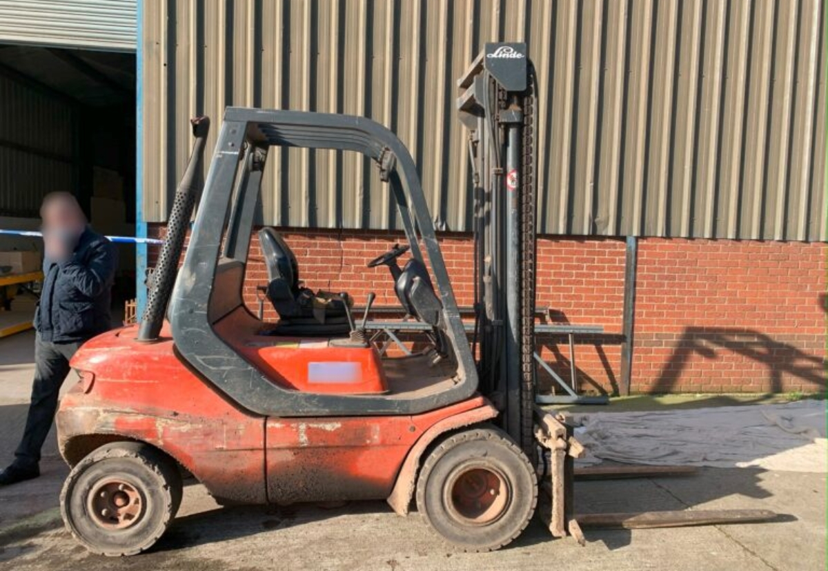 Mark Young had been lifted up to the roof using this forklift truck