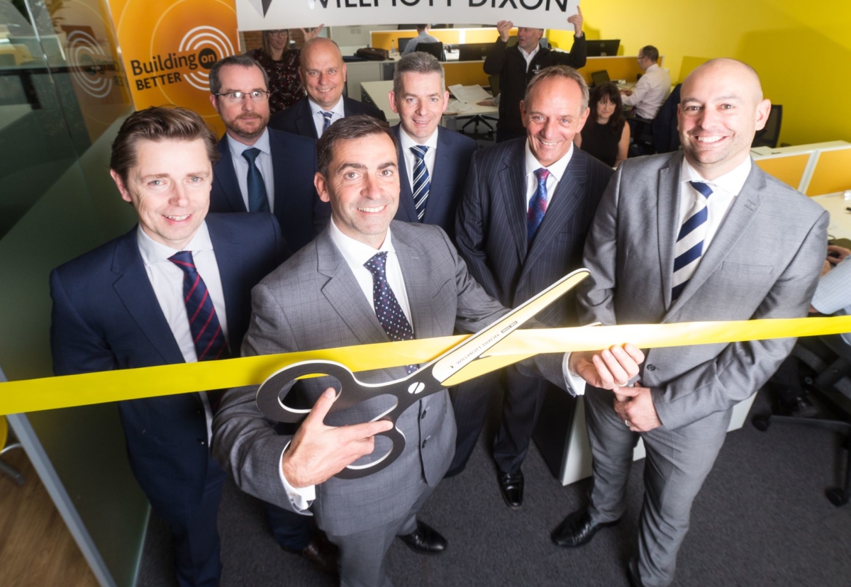 Regional MD Neal Stephens cuts the tape on the new office